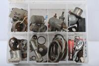 AMAL: A plastic container containing Amal carburettor parts and other motorcycle assortments.