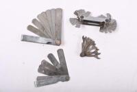 TOOLS: Four tools, including feeler gauges and a cute miniature spanner set