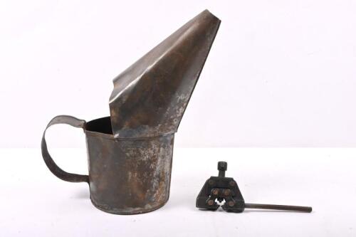 TOOLS: A metal oil can and chain cutter