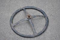 STEERING WHEEL: An early timber rimmed cast iron steering wheel, 43cm diameter [Location: Birregurra] - 2