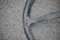 STEERING WHEEL: An early timber rimmed cast iron steering wheel, 43cm diameter [Location: Birregurra] - 3
