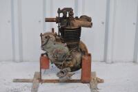 ENGINE: A small single cylinder motorcycle engine on stand with affixed Amil carbie, flywheel and magneto [Location: Birregurra]