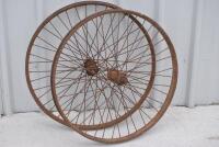 WHEELS: Two early motorcycle spoked wheels [Location: Birregurra]
