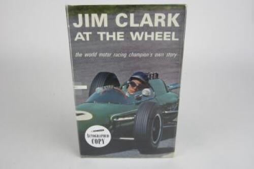 JIM CLARK: A Jim Clark signed copy of 'Jim Clark At The Wheel' by Arthur Barker.