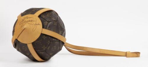 A limited edition Louis Vuitton soccer ball, cradle signed by actress Elizabeth Taylor