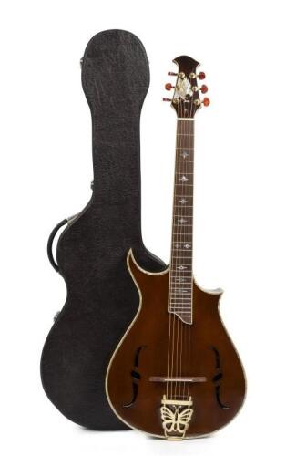 An Antonio Tsai walnut acoustic guitar, with mother of pearl inlay eagle, inlaid eagle on the head stock and stars leading down the neck of the guitar, 6 string