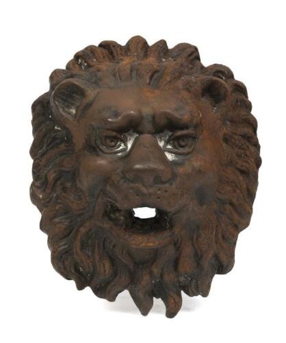A cast iron&nbsp;lion wall sconce, with hole in mouth for a lamp or fountain, 29.5cm high