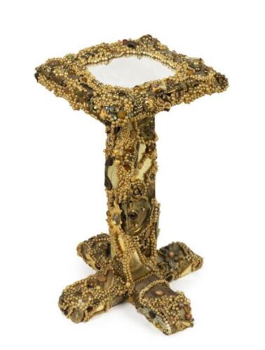 An elaborately decorated table previously owned by Bette Midler and Daryl Hannah, 67cm high