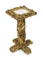 An elaborately decorated table previously owned by Bette Midler and Daryl Hannah, 67cm high