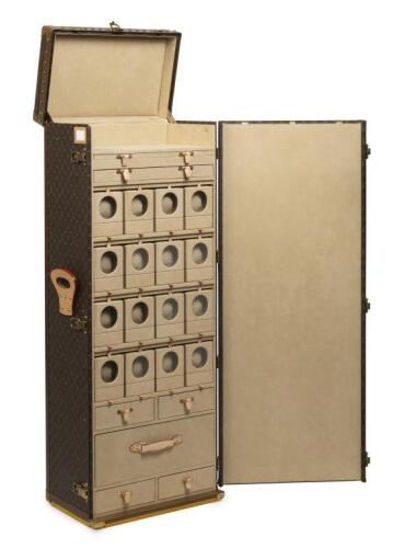 An exceptional special commissioned unique Louis Vuitton horologists watch cabinet, containing trays, drawers and 16 automatic winder compartments, sold with the original purchase receipt for $85,000 AUD, 143cm high