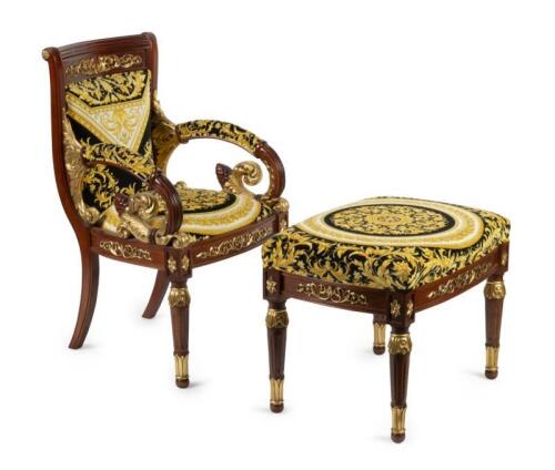 A Versace&nbsp;style chair and foot stool with &lsquo;Barocco Circle&rsquo; print upholstery in black and gold, 90cm high