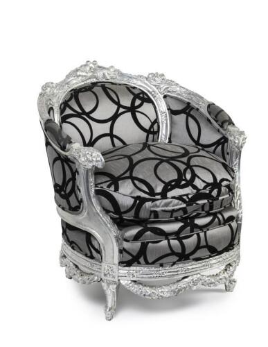 A black and silver arm chair, silver painted wood carved design along the arm rests, chair backing and legs, 87.5cm high