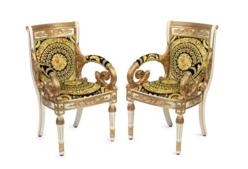 A pair of Versace&nbsp;style Vanitas arm chairs, beechwood hand carved structure with gold leaf ornaments, seat and back upholstered with Italian Versace fabric 90cm high