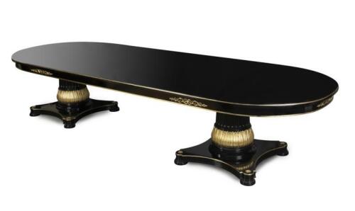 A Versace&nbsp;style Vanitas Dining Table,&nbsp;beech wood with black finish and gilt accents, oval top above two carved pedestals with concave bases, 380cm long