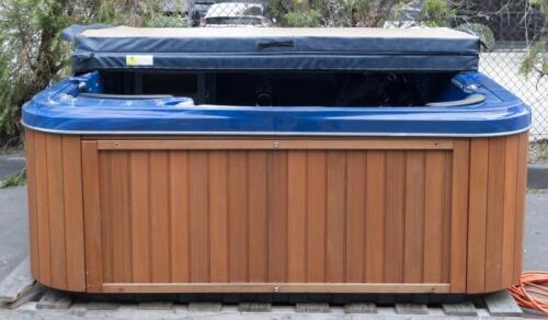 A Aeware 3, 7 person spa, midnight blue with faux wood surrounding, comes with cover, 221.5cm long
