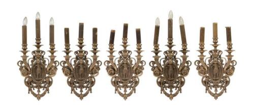 An impressive set of five gilt bronze wall lights each with a central eagle supporting floral scrolls, 60cm high, 33cm wide.