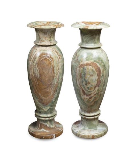 A large and impressive pair of slender Onyx urns, 91cm high