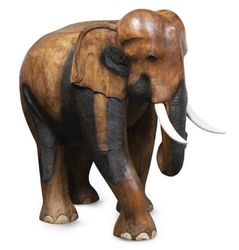 A medium/large solid teak&nbsp;elephant with painted&nbsp;timber&nbsp;tusks,&nbsp;106cm high, 87cm long, 56cm wide