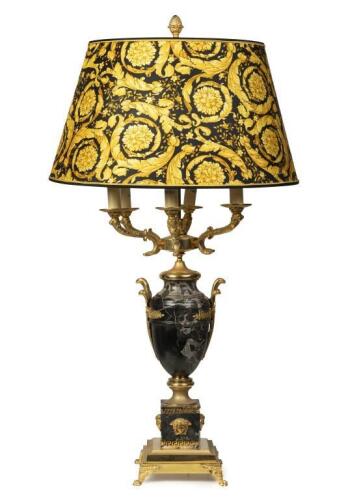 A Versace onyx and gilt bronze table lamp with raised Medusa head masks, leaf scroll arms with ornate Barocco lamp shades, 108cm high, 58cm wide.