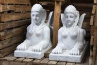 A impressive pair of heavy carved stone Egyptian winged&nbsp;Egyptian sphinx sculptures, 121cm high, 74cm long, 37.5cm wide, fitted within timber crate.&nbsp;&nbsp;