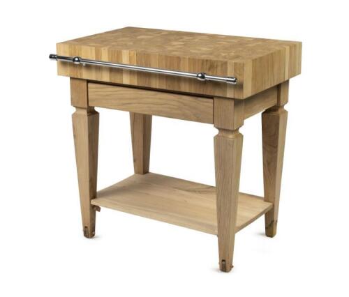 A rectangular versatile oak butcher's block table raised on tapering square legs, Practical and versatile, it can be positioned freely in the kitchen and is accessible and usable from all sides, 90cm high, 89.5cm long, 55cm wide