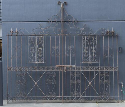 A pair of large and impressive cast&nbsp;iron gates,&nbsp;298.5cm high, 159cm wide, (318cm wide overall)