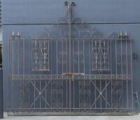 A pair of large and impressive cast&nbsp;iron gates,&nbsp;298.5cm high, 159cm wide, (318cm wide overall)