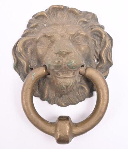 A brass lion mask door knocker, 15cm high, 12cm wide&nbsp;