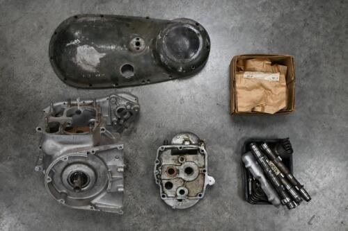 TRIUMPH TRW: A collection of Triumph TRW spares including a set of crank cases, set of fly wheels, four cams for fitting in crank case, timing side chain cover, gear box inner, set of valve springs and assortment of timing side bearings.