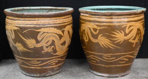 A pair of Chinese jardinieres features dragons with turquoise glaze on the inside, 50cm high, 51cm diameter