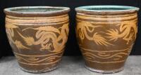 A pair of Chinese jardinieres features dragons with turquoise glaze on the inside, 50cm high, 51cm diameter