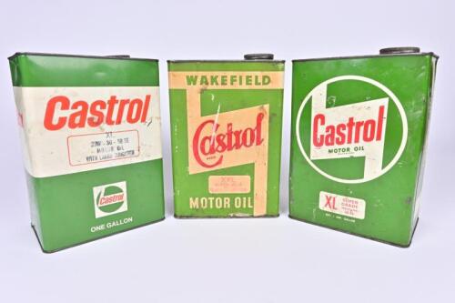 CASTROL: Three Castrol one gallon oil cans of varying periods.