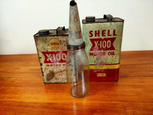 SHELL: Three Shell 'X-100 items including two cans and a glass oil bottle.