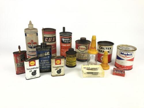 GARAGENALIA: A collection of garagenalia items. Small oil cans, tins