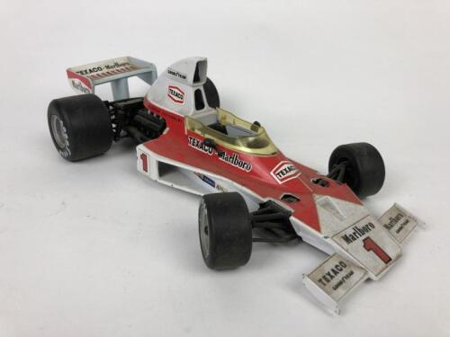 BBURAGO/POLISTIL: Two Formula 1 models. Alfa Romeo and McLaren (1:14 & 1:16 scale)