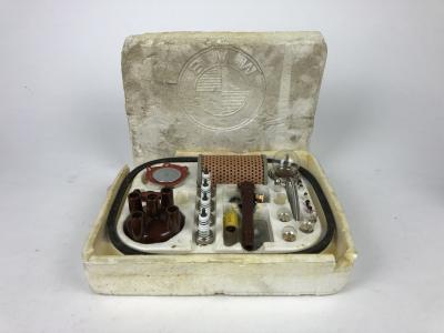 B.M.W: An interesting and rare B.M.W service box, with distributor cap, spark plugs, filter, etc. Circa late 1960's - 1970's