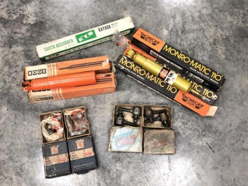 SUSPENSION/SHOCK ABSORBERS: A group of suspension parts. Shock absorbers, tie rods. Some unused