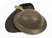 HELMET: A metal military helmet with leather neck sun guard, 13cm high, 30cm wide&nbsp;