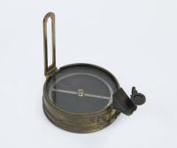 COMPASS: An early interesting brass surveying prismatic compass, believed to be war time use by the British. 9cm diameter.