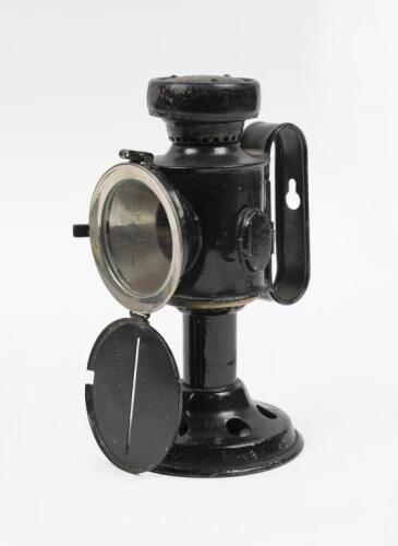 CANDLE LAMP: A black World War One candle lamp, 20.5cm high