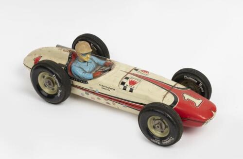 TIN CAR: A rare 1960s 'Champion Racer Indianapolis Special' friction-powered tin plate toy made in Japan by Yonezawa, 45cm long.