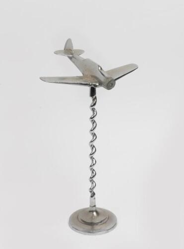 WWII: A WWII period metal aeroplane, with Bali twist stand, 37cm high.
