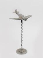 WWII: A WWII period metal aeroplane, with Bali twist stand, 37cm high.&nbsp;&nbsp;