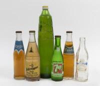 BOTTLES: A varied collection of mostly unopened soft drink bottles including, Tarax, Fanta, 7 UP etc.