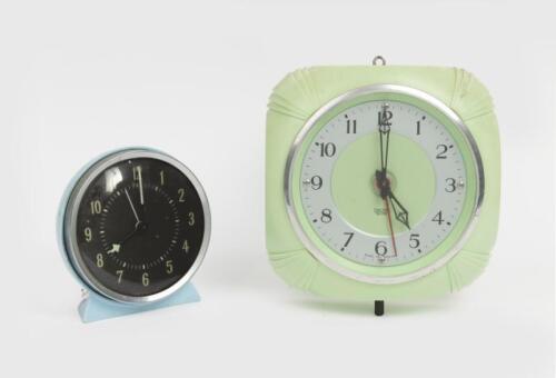 CLOCKS: A vintage 'Smiths Sectric' green bakelite wall clock, and a blue plastic windup clock.