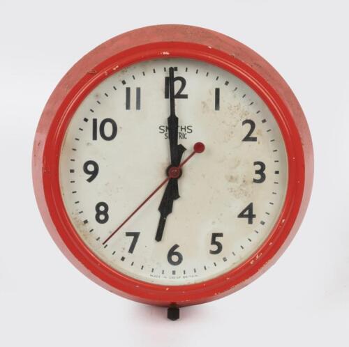 CLOCK: A red 'Smiths Sectric' clock.