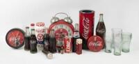 COCA COLA: A collection of Coca Cola memorabilia including, clocks, unopened bottles, glasses, containers, cans&nbsp;and a Coca Cola fridge light.