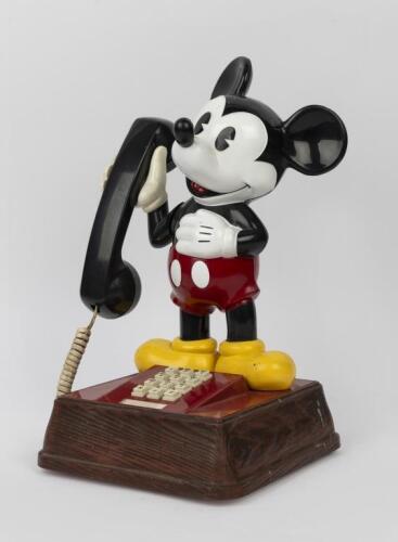 MICKEY MOUSE: A collection of Mickey Mouse memorabilia including a vintage Mickey Mouse telephone, as well as a Minnie Mouse ceramic jar.