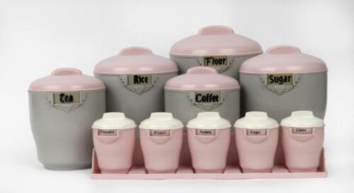 BRISTOLITE: A set of five Bakelite kitchen canisters in grey and pink, with a complete Bakelite spice set in pink and white with display tray