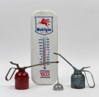 OILERS: A&nbsp;collection of three hand&nbsp;oilers,&nbsp;along with a reproduction&nbsp;Mobilgas thermometer, which&nbsp;measures 40.5cm high.